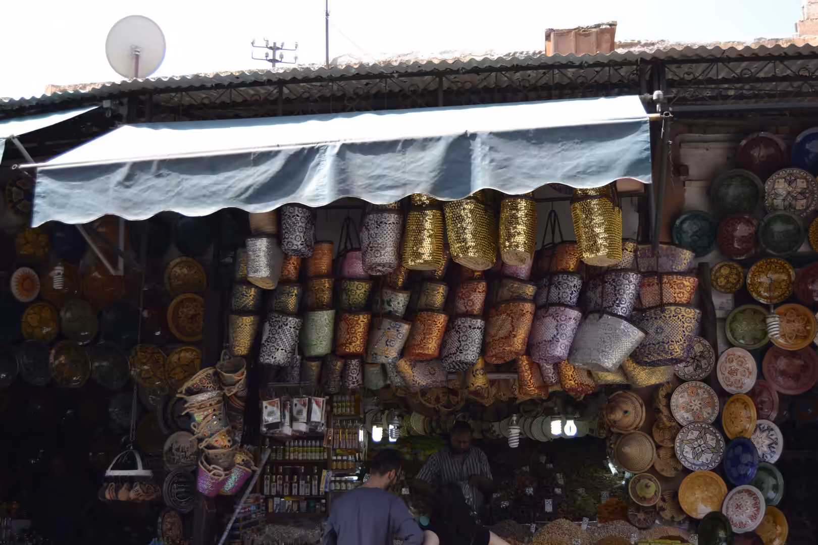 Shop displaying colorful lanterns and woven baskets in the Medina of Marrakech