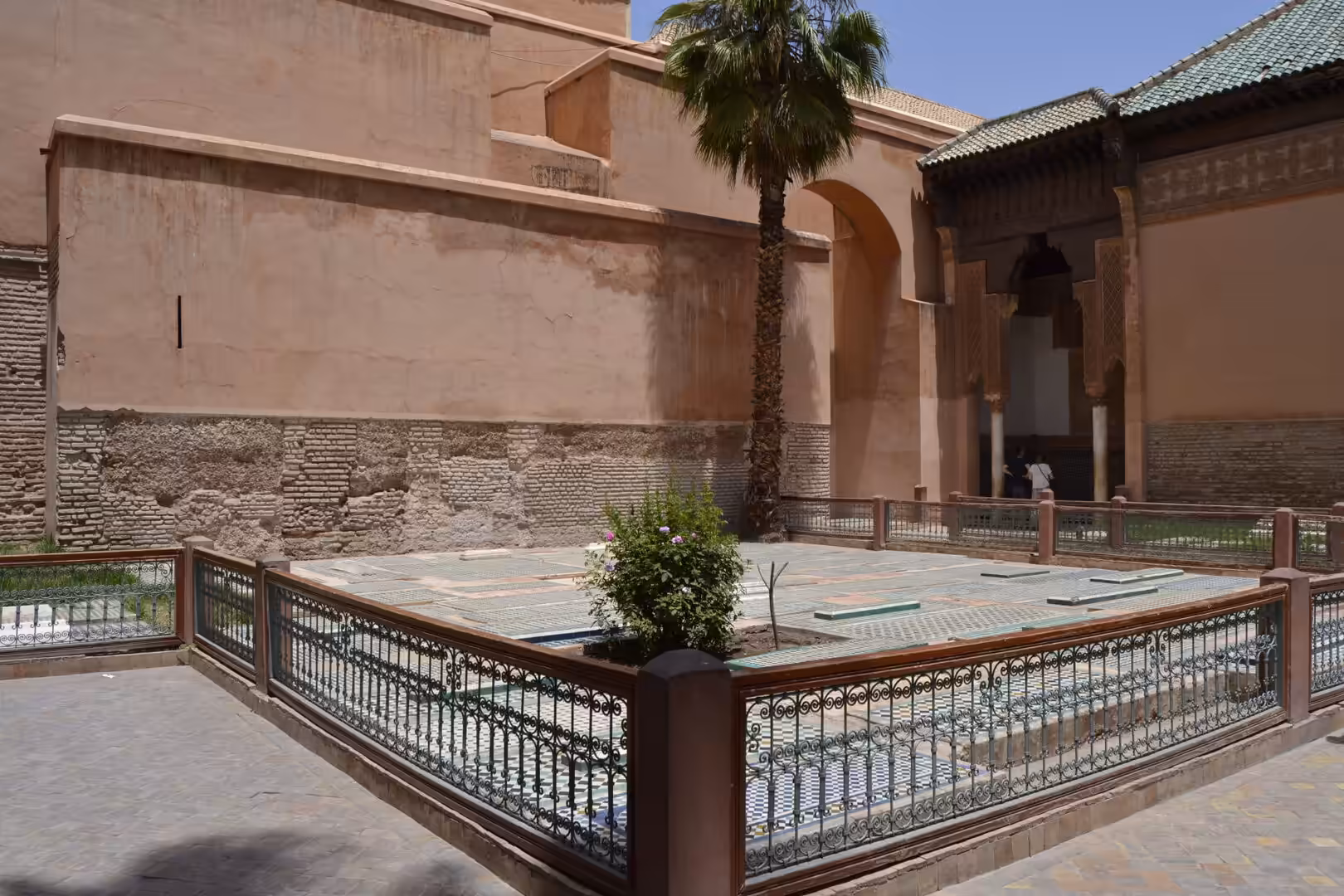 Courtyard with tiled floor and palm tree at the Saadian Tombs