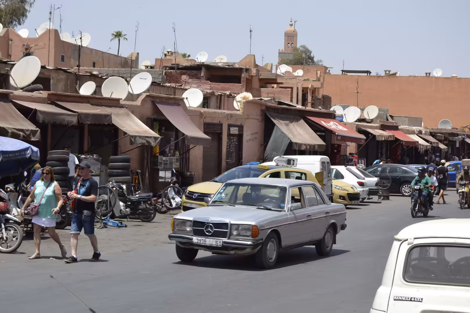 Street with taxis and shops in Marrakech