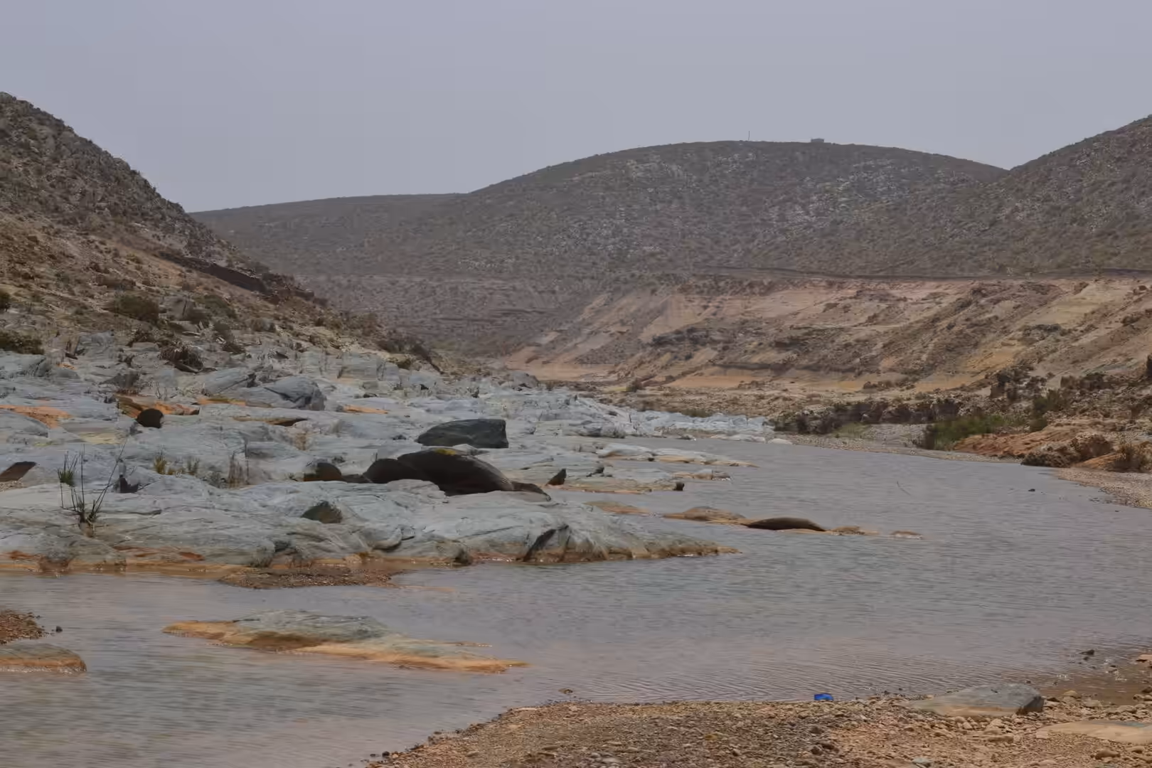 Shallow river flowing through rocky wadi south of Sidi Ifni