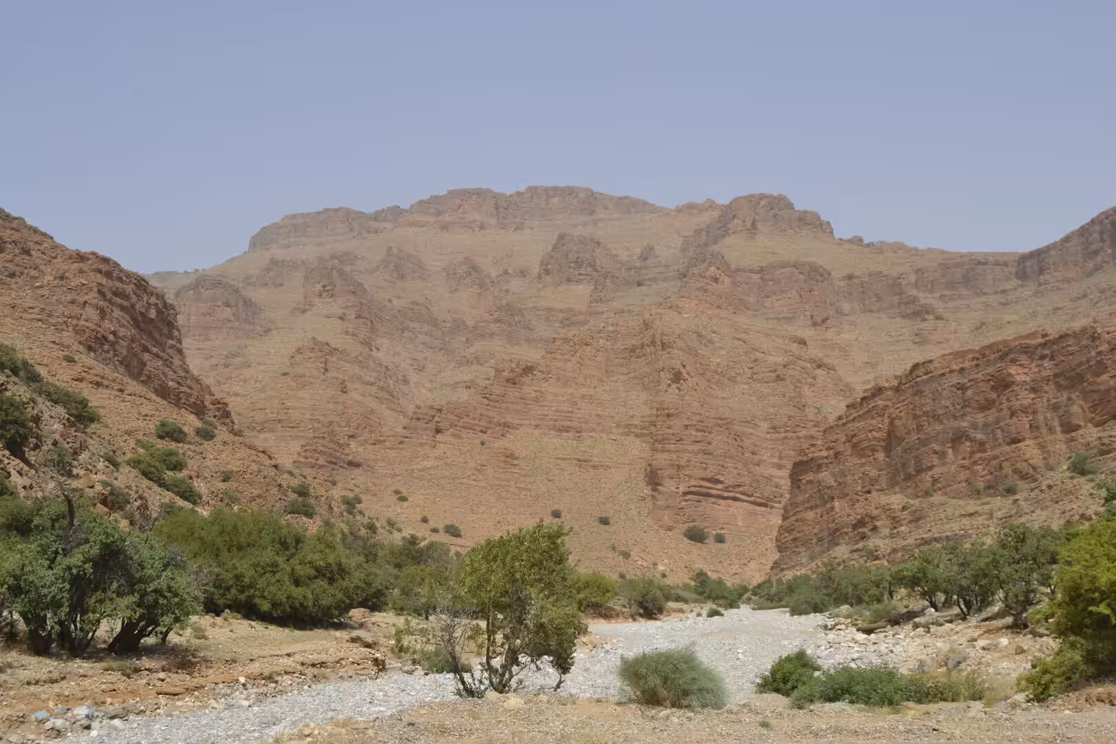 Dry riverbed and canyon cliffs in the Anti-Atlas Mountains, Morocco