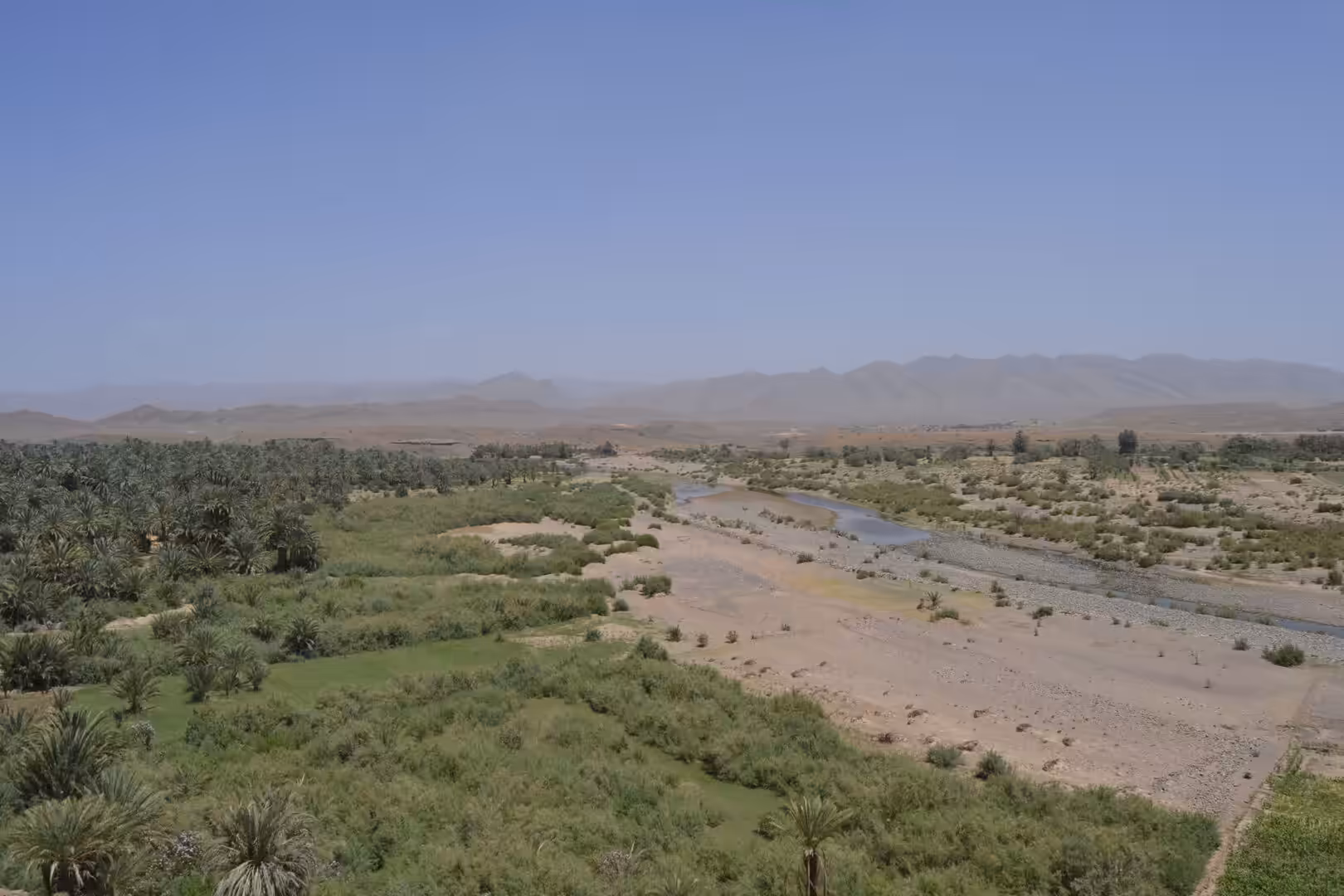 River flowing through desert oasis landscape in Morocco