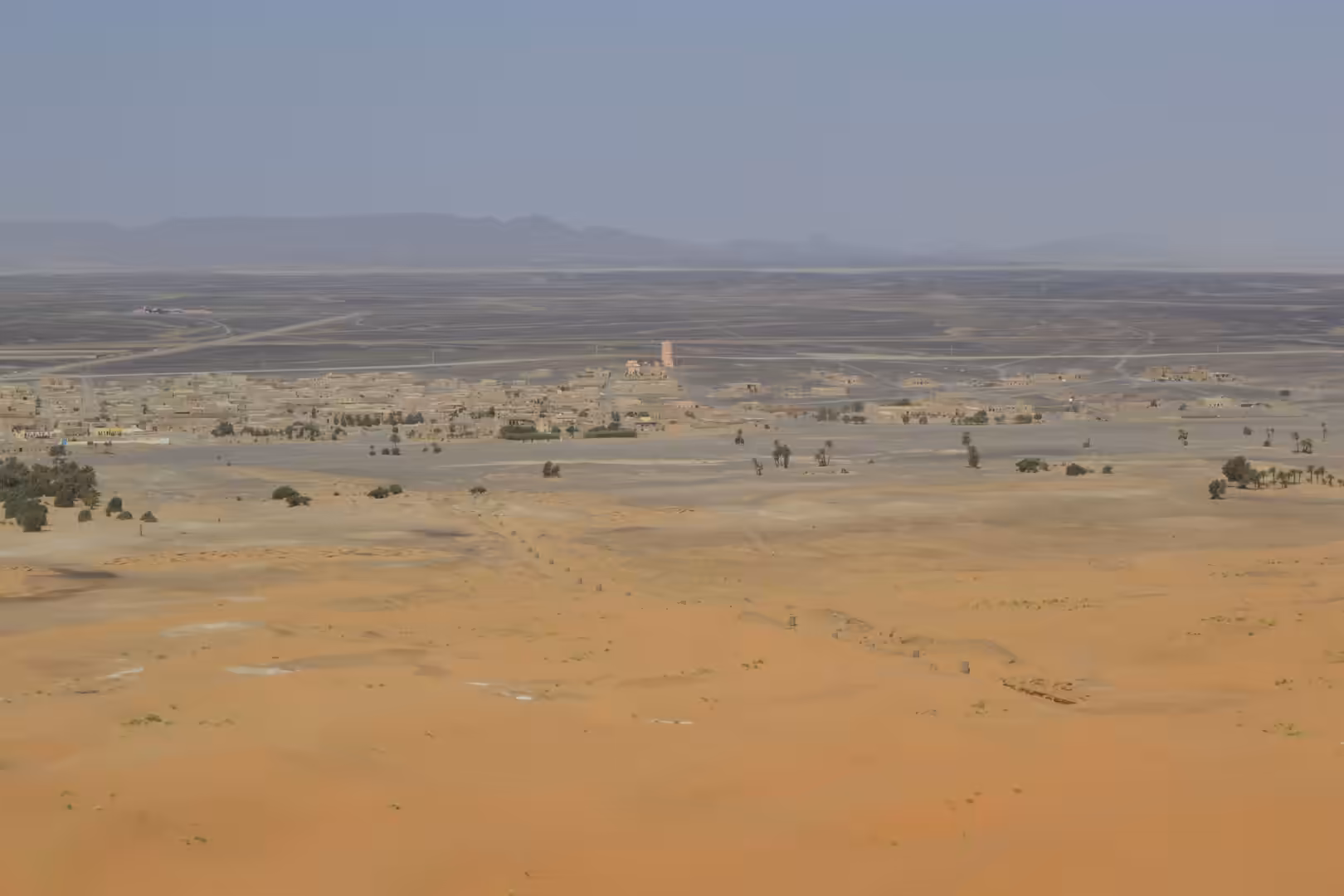 View of Merzouga village from Sahara dunes