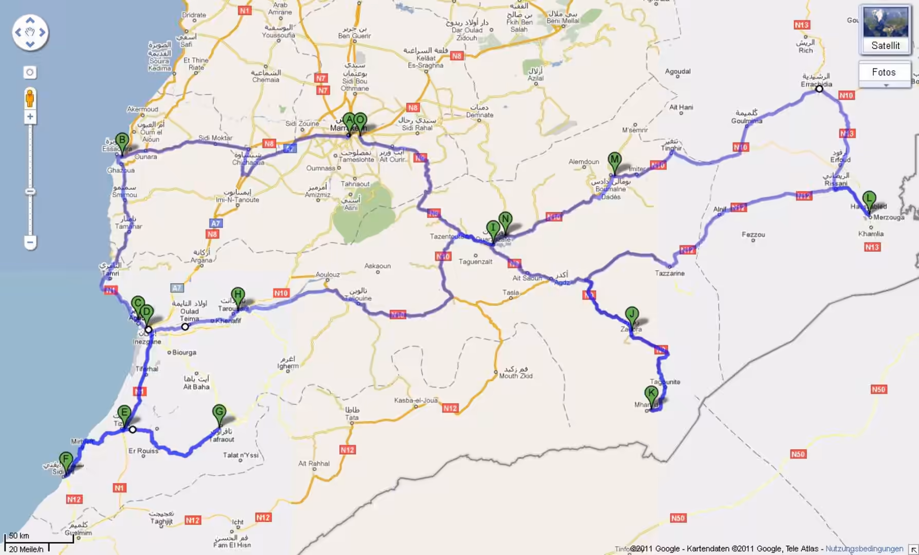 Road map showing a long-distance driving route across Morocco, linking coastal cities, Atlas Mountains, and desert regions.