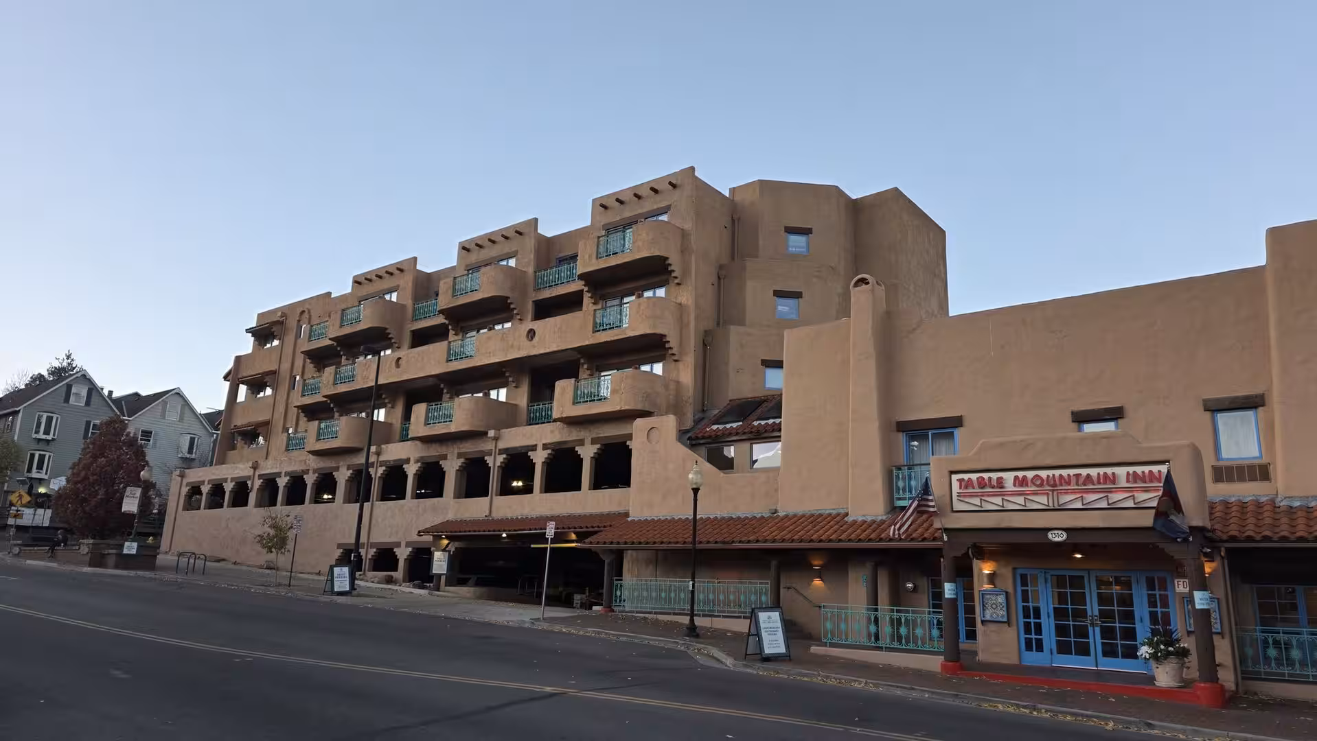 Adobe-style hotel building at dusk in downtown Golden, Colorado