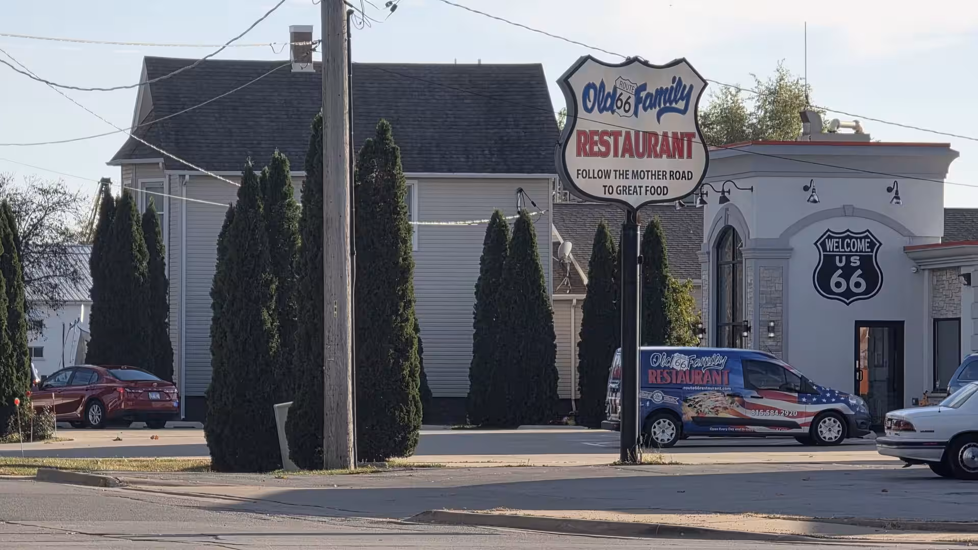 Route 66-themed family restaurant with large roadside sign in Dwight, Illinois.