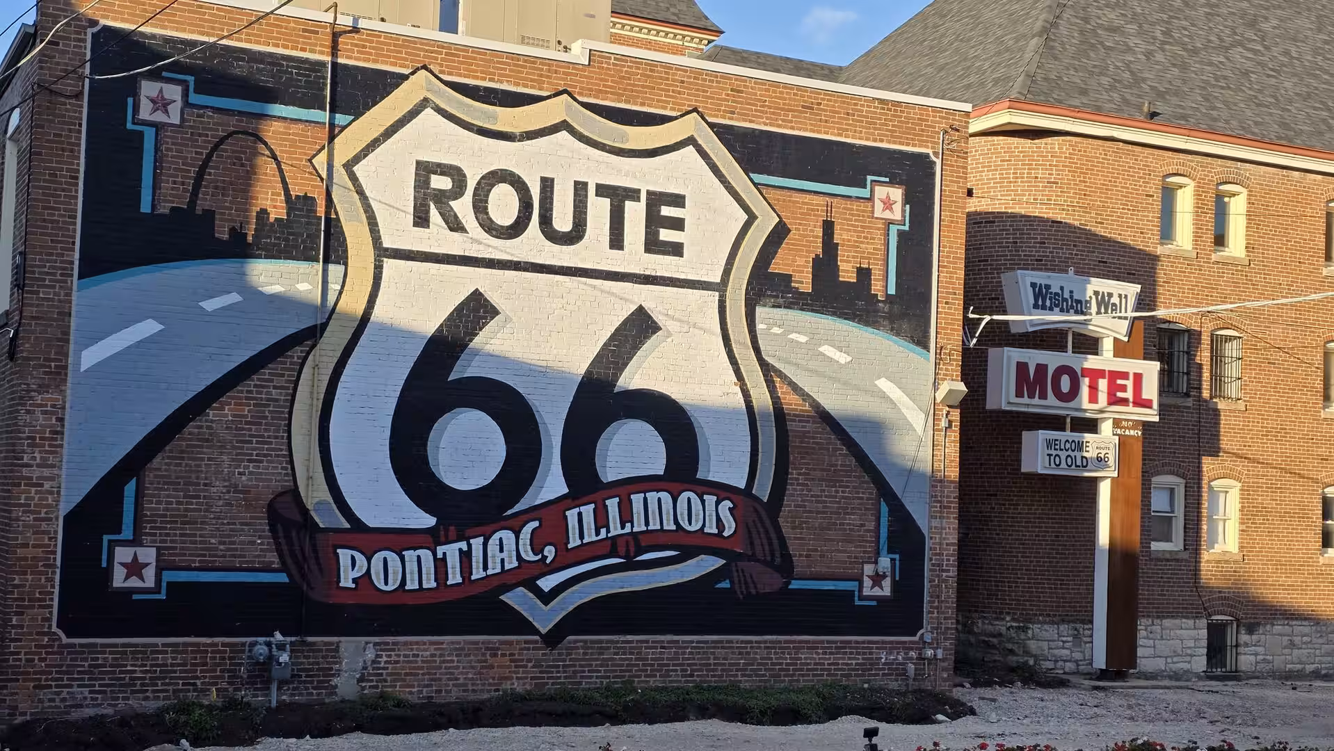 Large Route 66 mural on a historic brick building in Pontiac, Illinois.