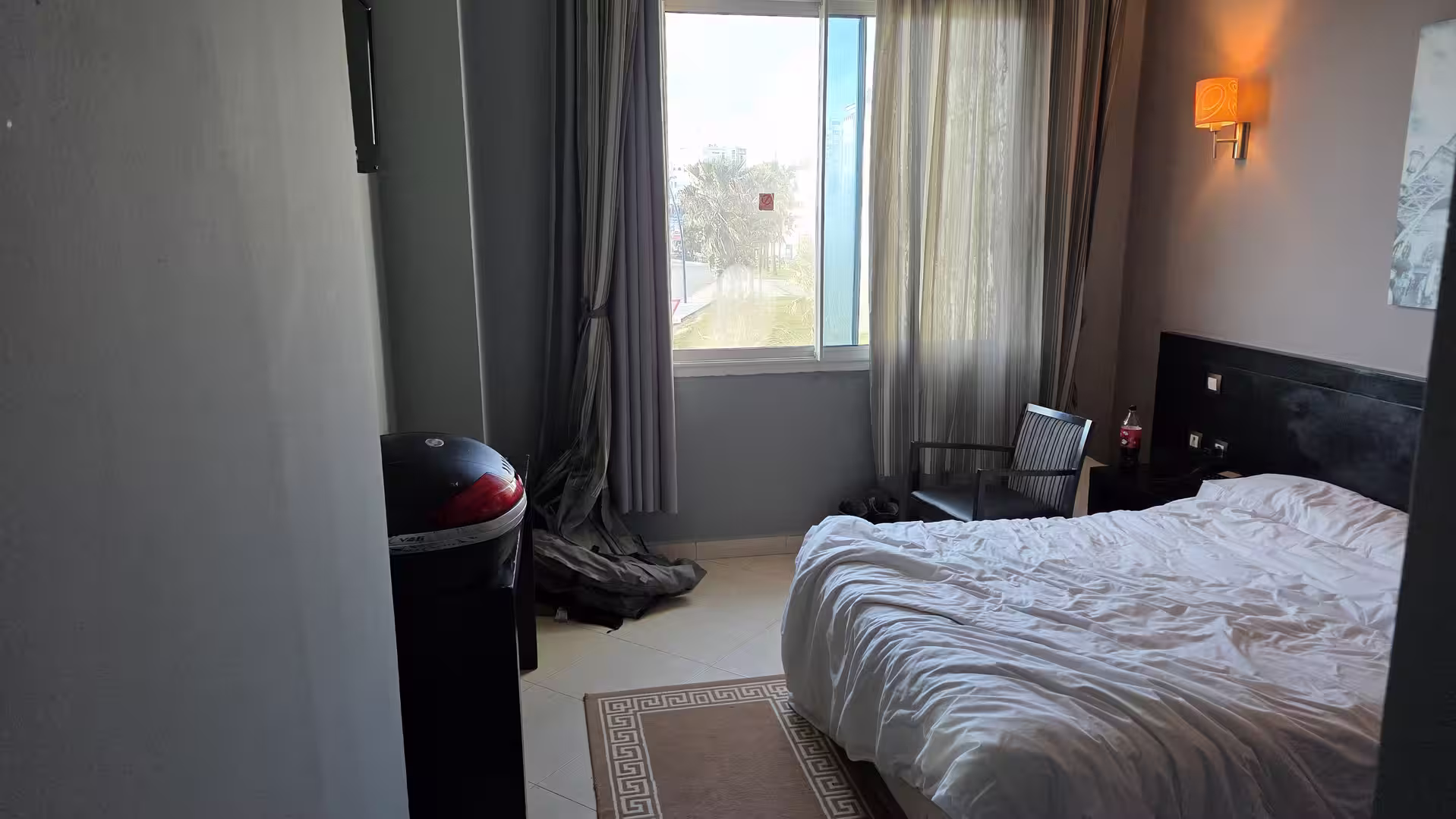 Simple hotel room in Morocco during an overland motorcycle journey.