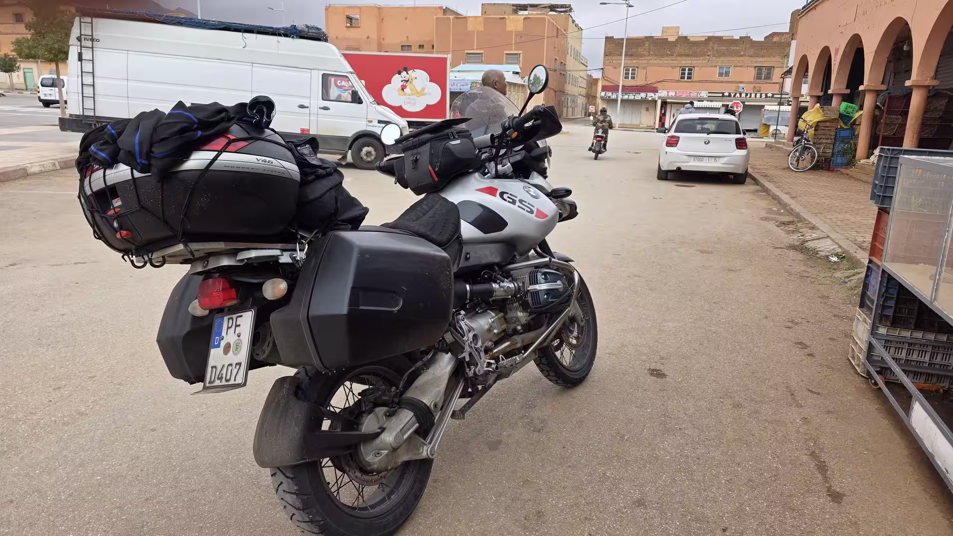 A fully loaded BMW GS motorcycle parked on a street in Bouarfa, eastern Morocco.
